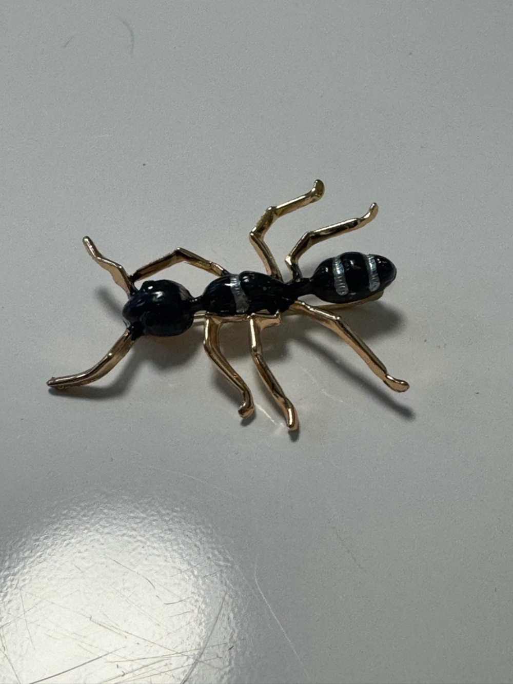 Enamel Brooch Pin in Black and Gold